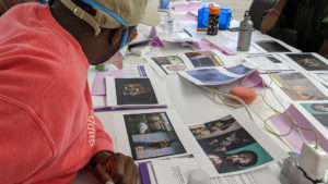 Playwright and actor Terry Guest looks at research and inspirational imagery at the first rehearsal for The Magnolia Ballet at About Face Theatre. Photo by Charles Riffenburg.