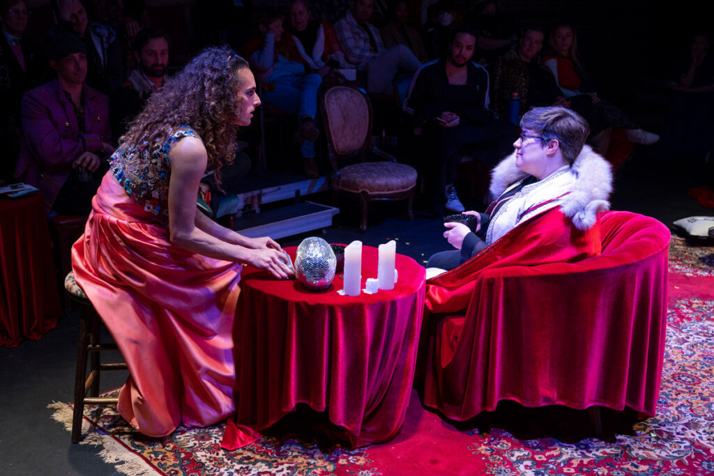 Performer Will Wilhelm gives a tarot reading to an audience member in Gender Play, or what you Will. Photo by Michael Browsilow.